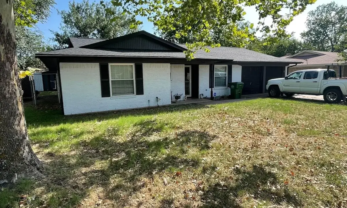 Professional roofing crew working on a residential roof in Lower Gwynedd